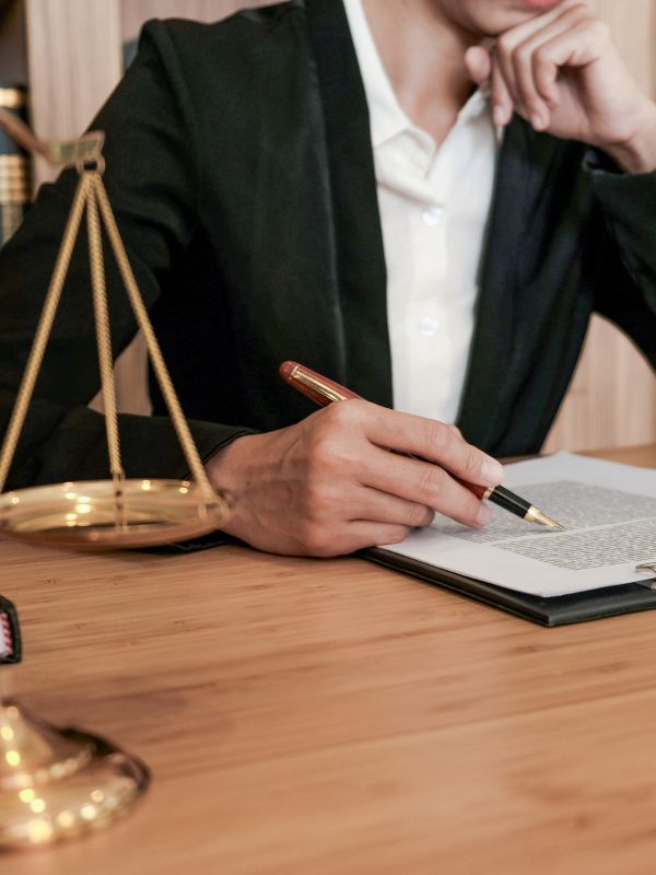 A criminal defense lawyer sitting at his desk