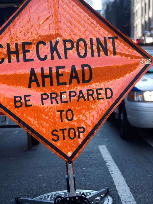 A DUI checkpoint sign that says "Checkpoint ahead"