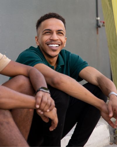 expungement a man smiling with friends after having his record expunged
